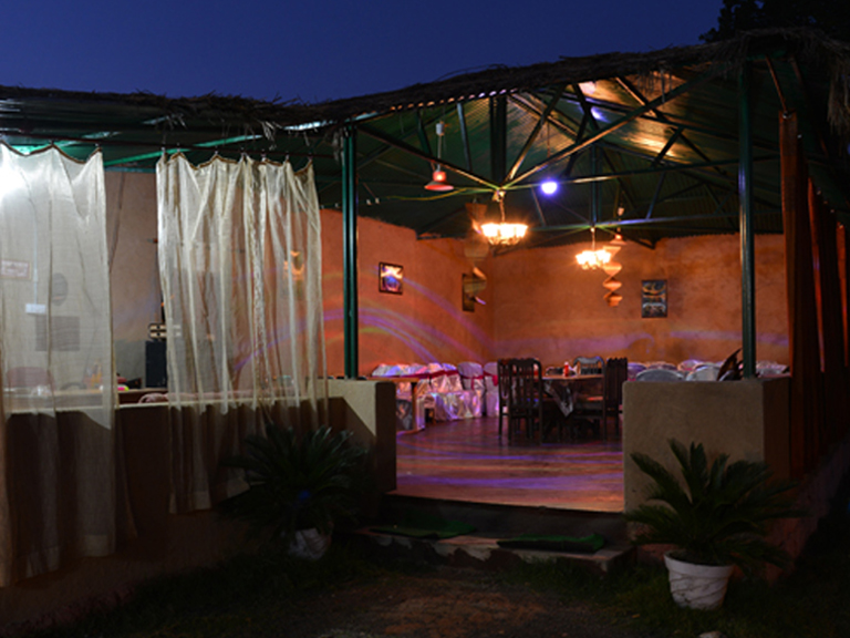 Open-air dining pavilion at night