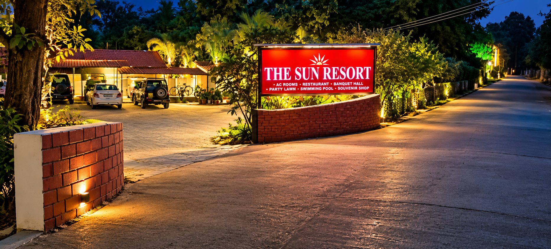 Resort entrance and signboard at night