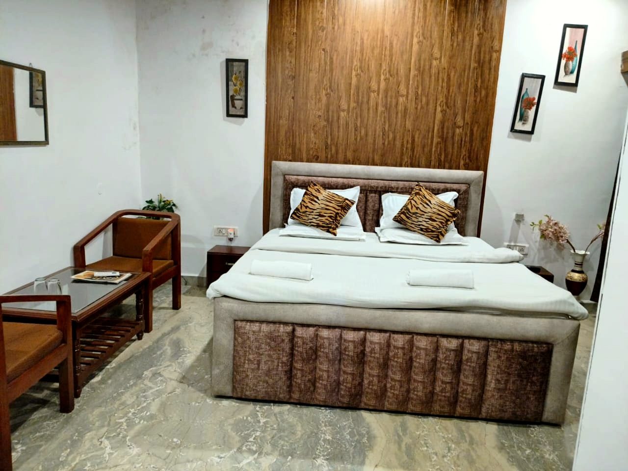 Non-AC room at The Sun Resort Bandhavgarh with a double bed and wooden panelling