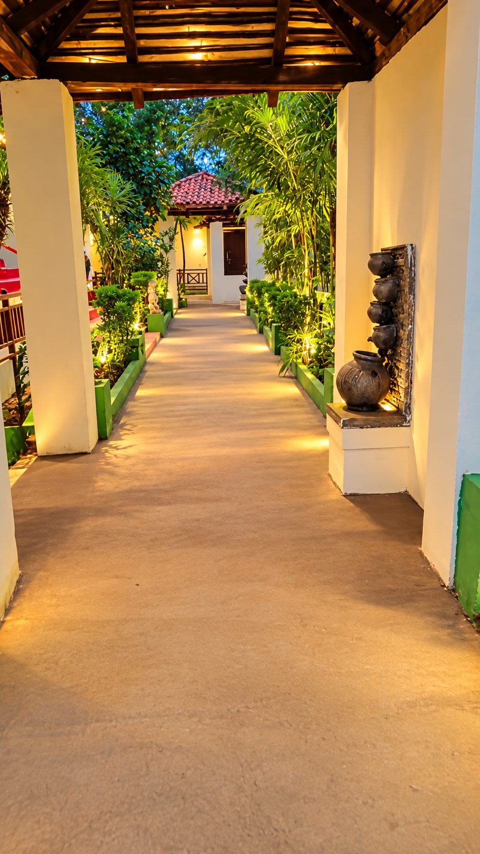 Lamp-lit walkway between cottages