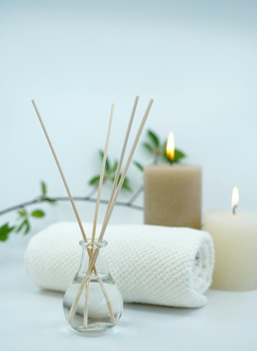 Reed diffuser, rolled towel and candles set for a calm spa moment
